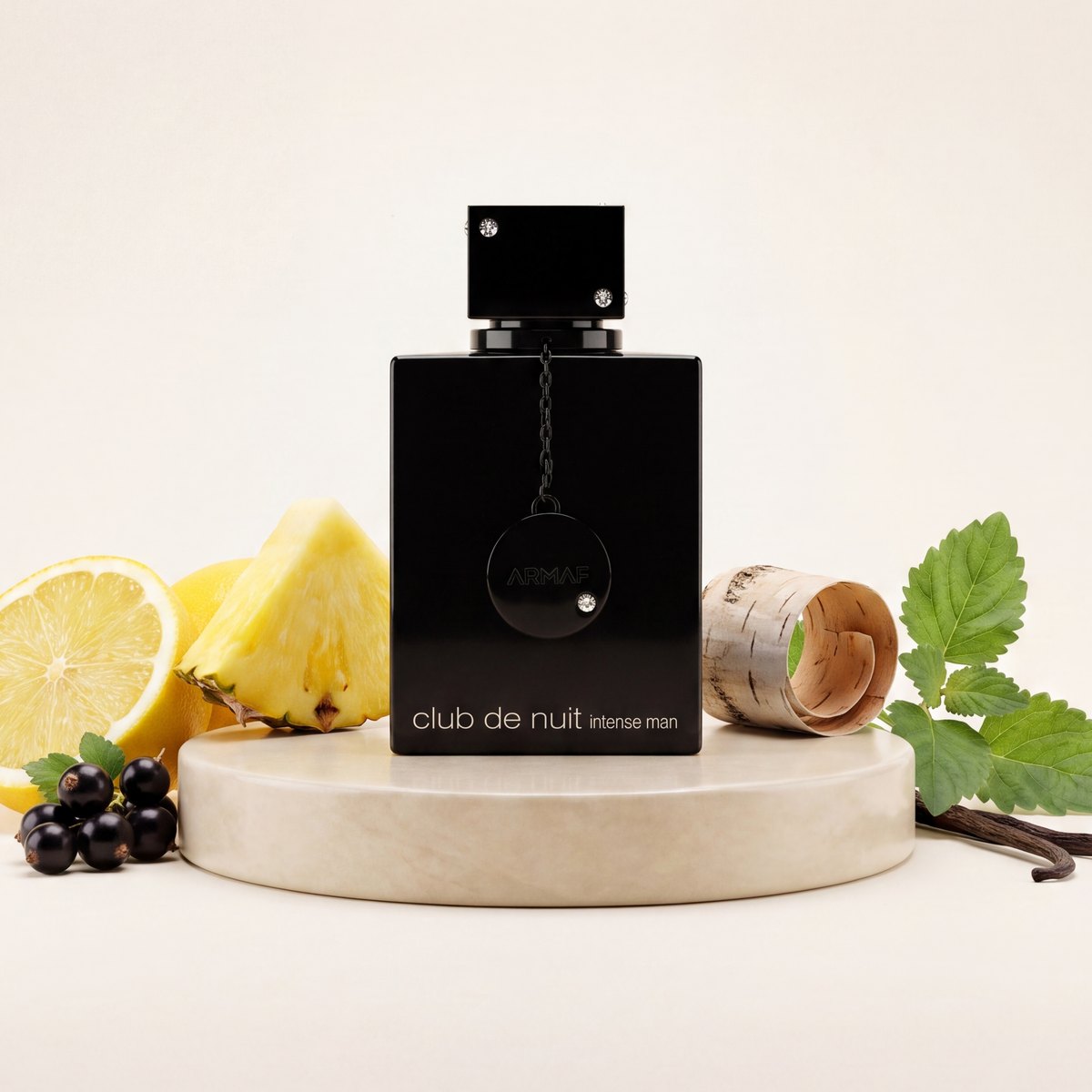 Armaf Club de Nuit Intense Man eau de parfum bottle on a stone plinth with lemon, pineapple and mint