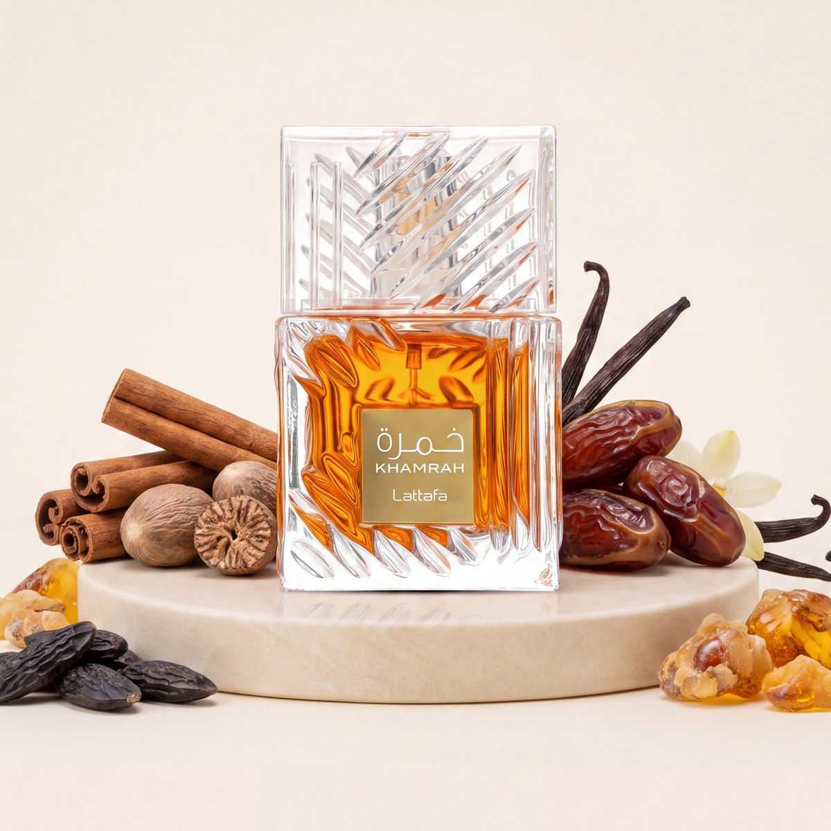 Lattafa Khamrah eau de parfum bottle on a stone plinth with dates, cinnamon and vanilla