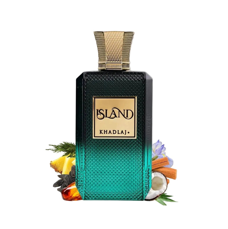 A rectangular perfume bottle labeled ISLAND KHADLAJ, with a black-to-teal gradient textured body and a gold cap, styled with tropical ingredients like lemongrass, citrus, cinnamon, and a coconut on a white background.