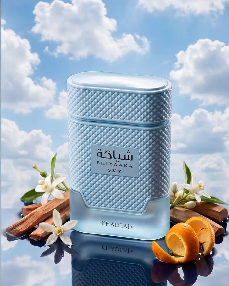 Khadlaj Shiyaaka Sky perfume bottle against a blue sky with clouds